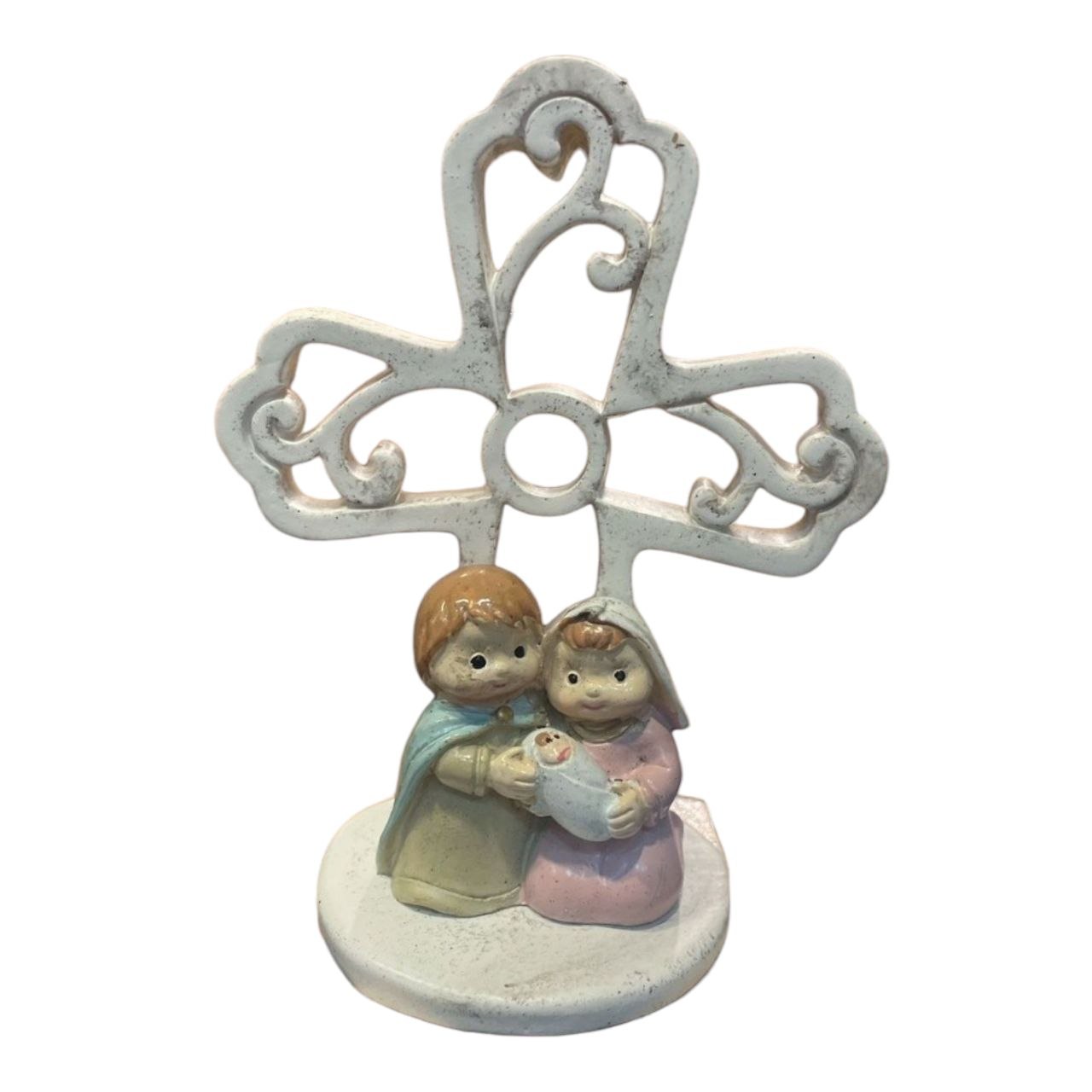 The Holy Family and a hollow cross