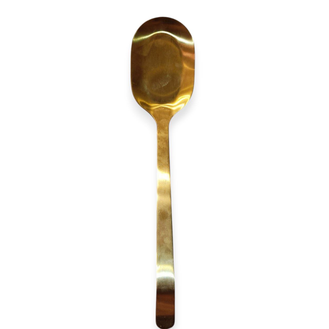 Gold serving spoon