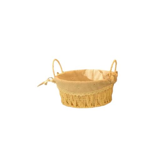 Oval beige fabric and wicker basket