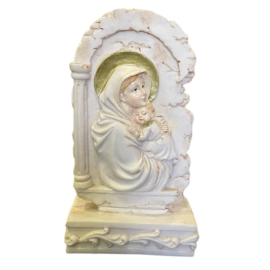 The Holy Mother Mary and Child Jesus on a rock wall