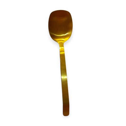 Golden serving spoon