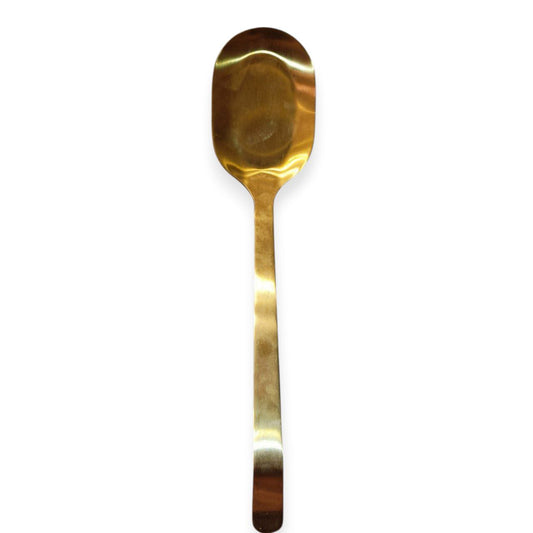 Gold serving spoon