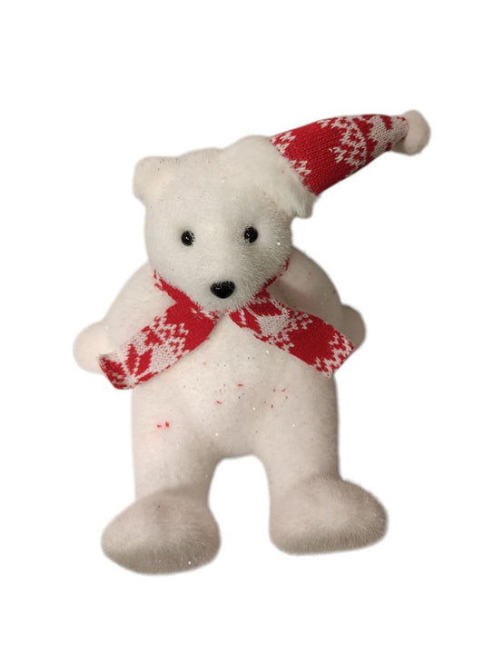 A red sitting teddy bear