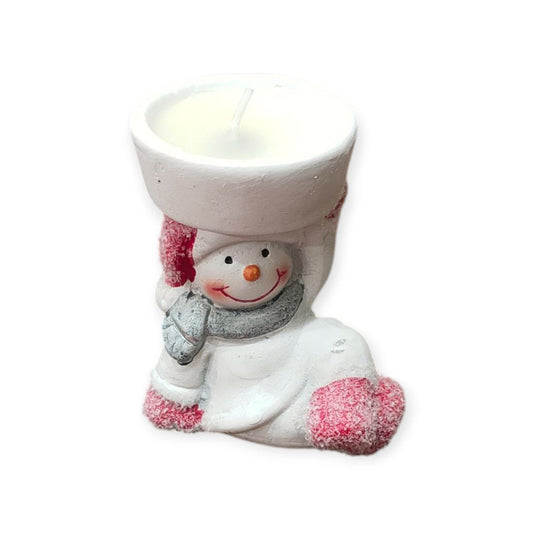 Snowman candle sitting