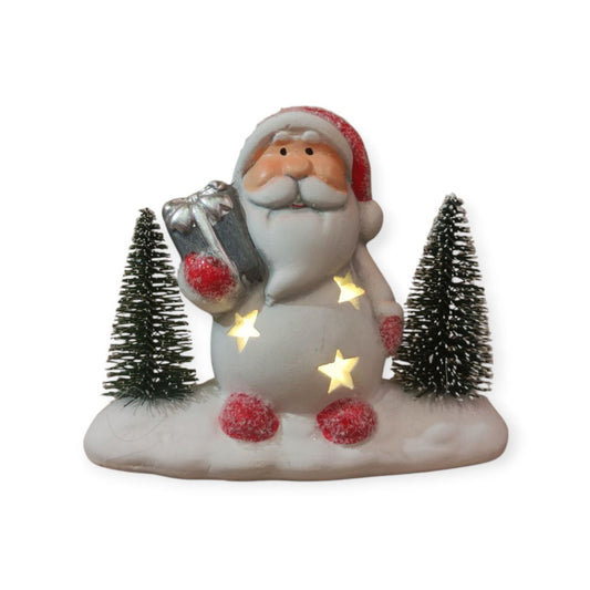 Santa by a lighted tree