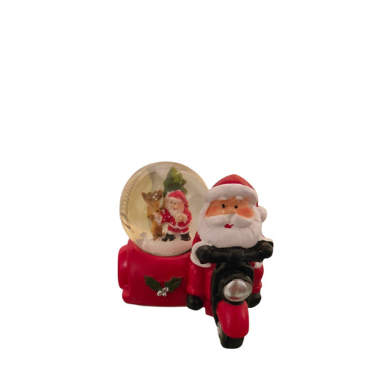 Small snow ball of Santa on a motorcycle