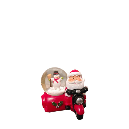 Small snow ball of Santa on a motorcycle