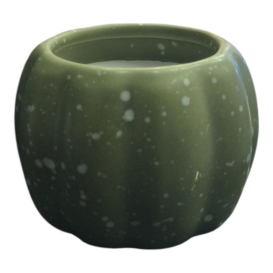 Pumpkin-shaped candle